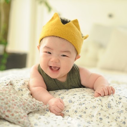 An adorable smiling infant.