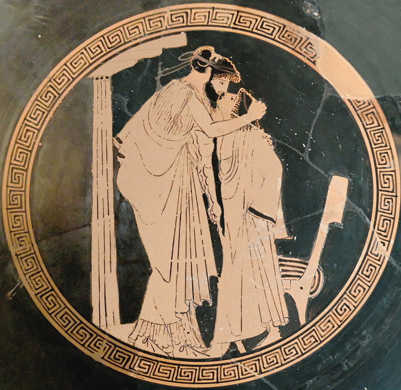 An image on an ancient Greek drinking cup of two lovers kissing. c.a. 480 BC.